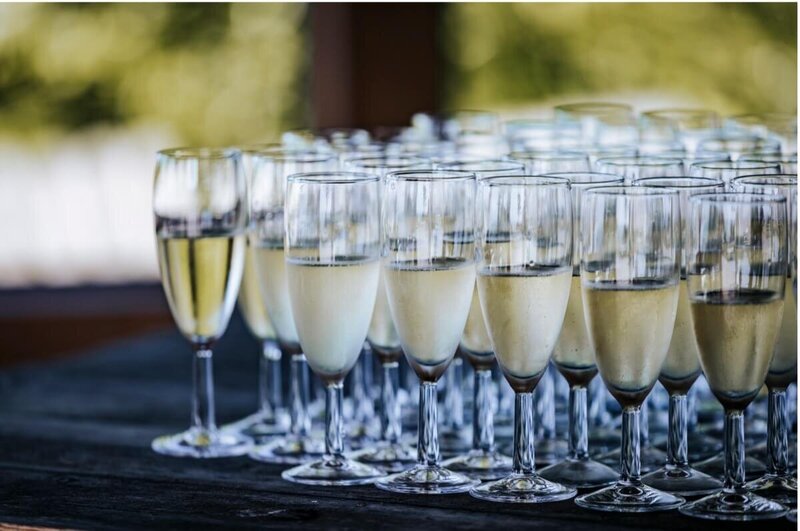 a table full of glasses filled with champagne