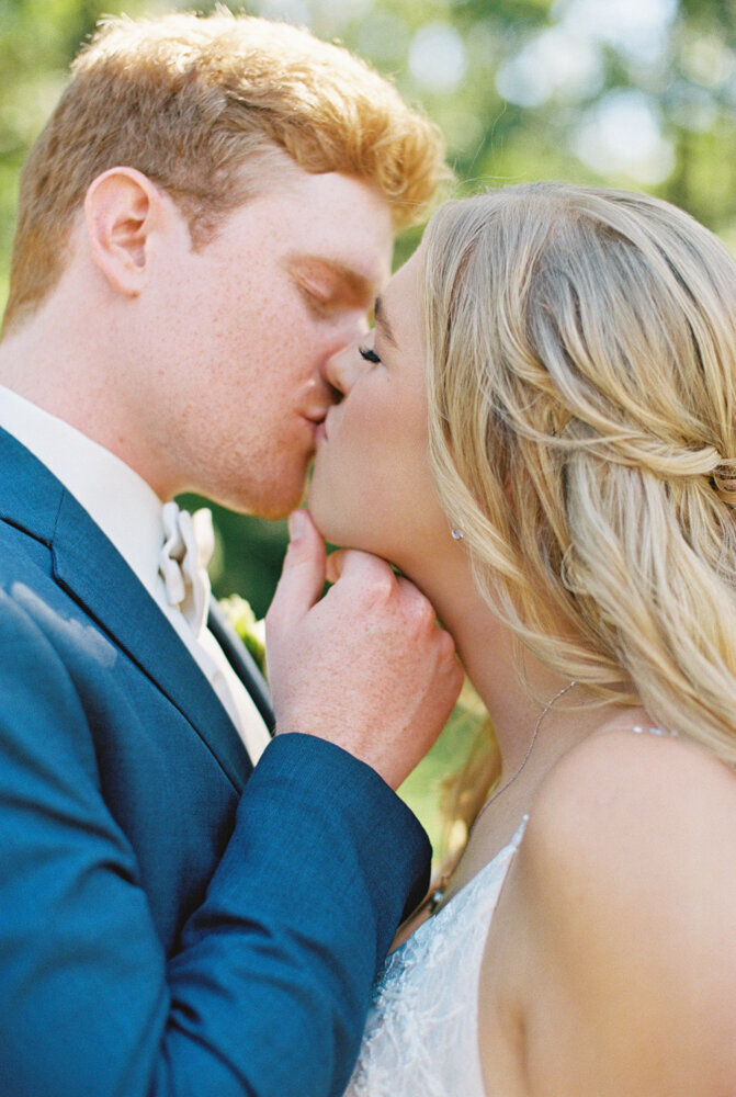 bride and groom kissing