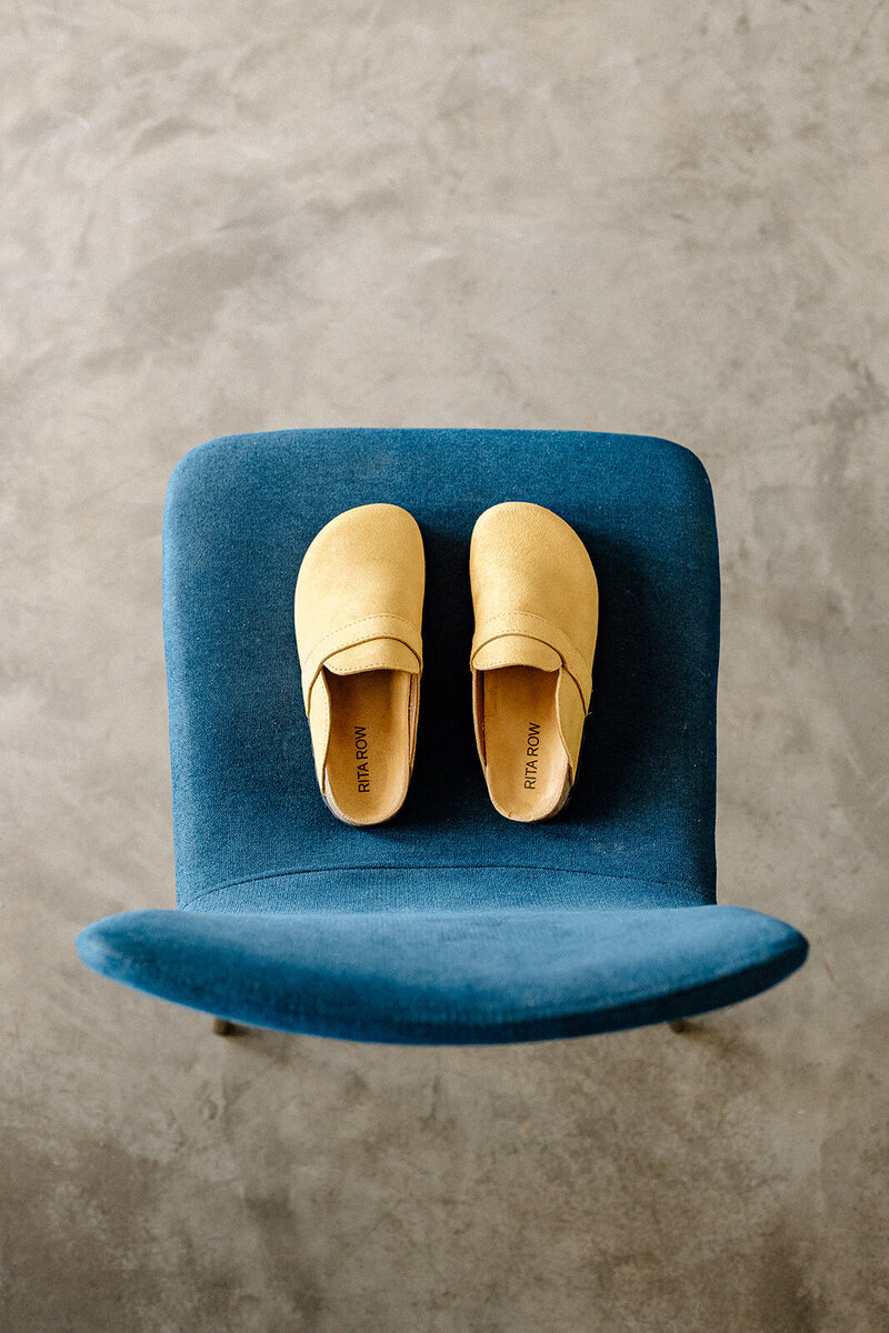 yellow shoes on blue chair