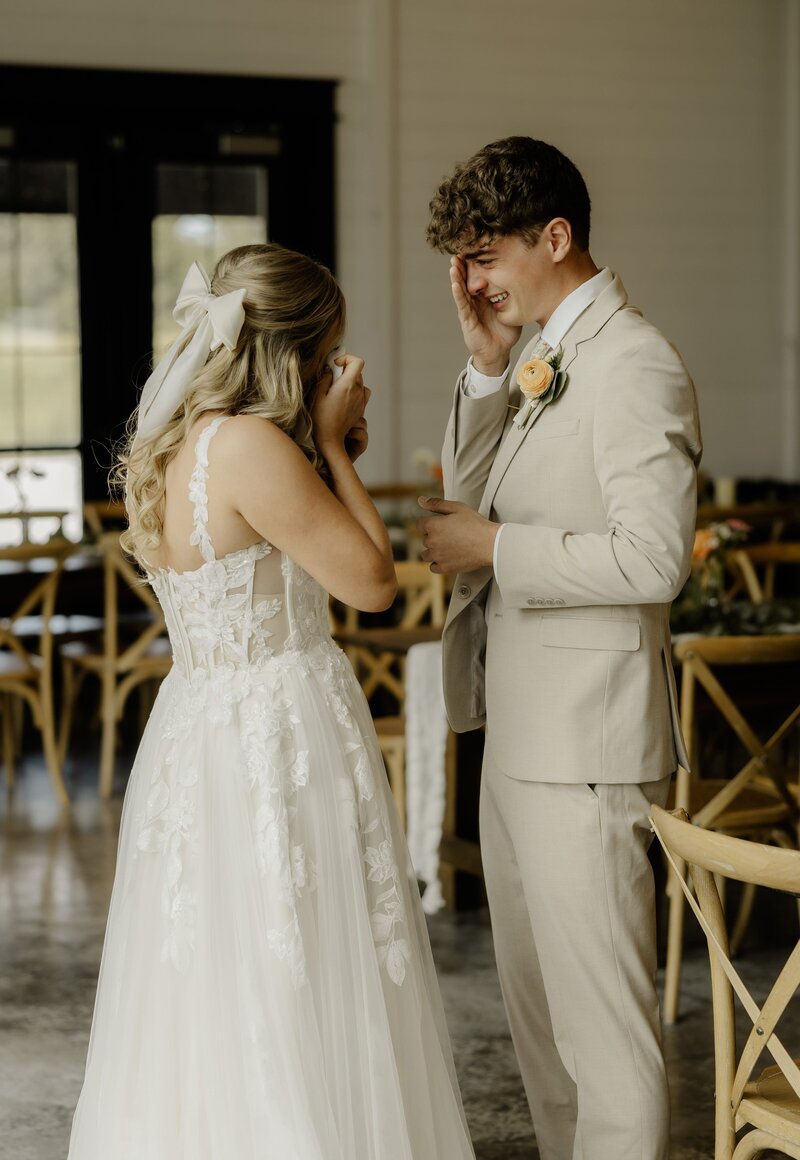 Bride and groom shed tears with each other at their first look.