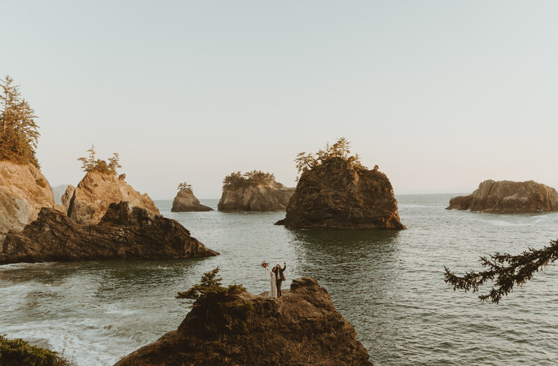Couple standing on mountain at Elopement at the Oregon Coast