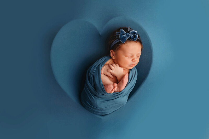 Newborn Baby posed for Newborn Photos in Asheville, NC.