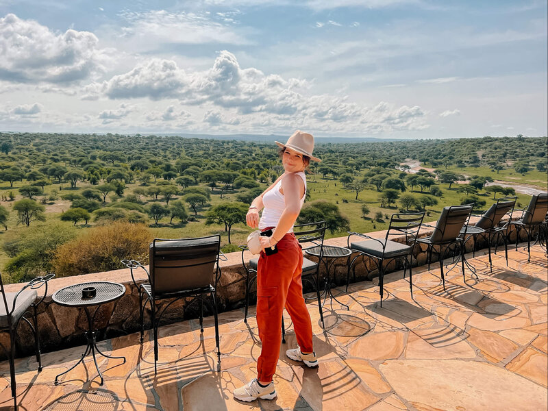 Jenna looking over shoulder viewing out over the Serengeti