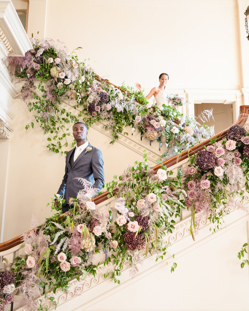 A bride and groom laugh as they exit their wedding ceremony