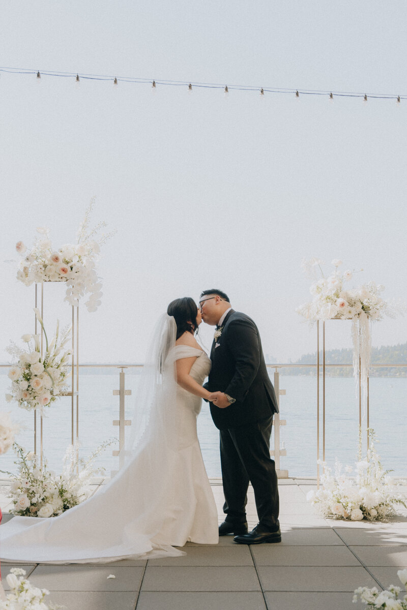 couple kissing down the aisle