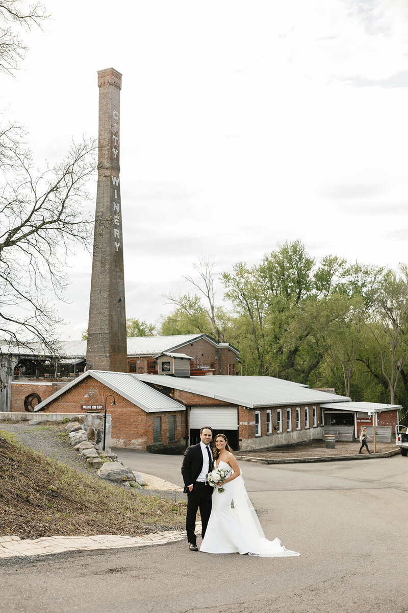 Bride and groom taking golden hour photos at a Catskills wedding, planned by KR Occasions