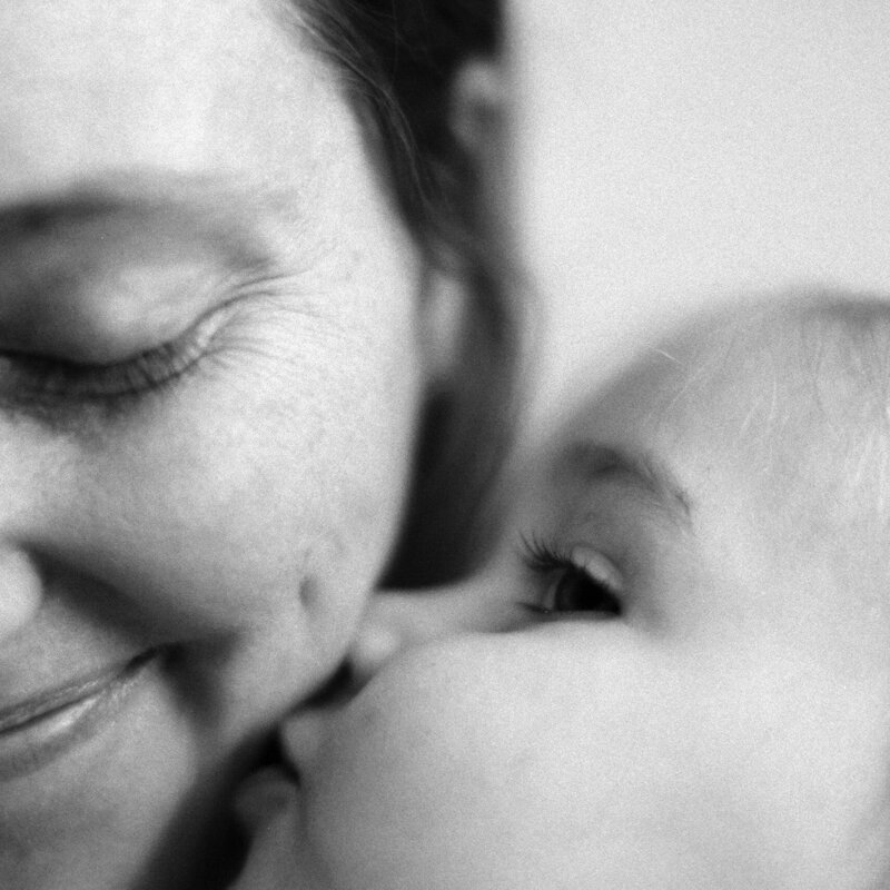 Black and white close up photo of Britni Dean and her daughter