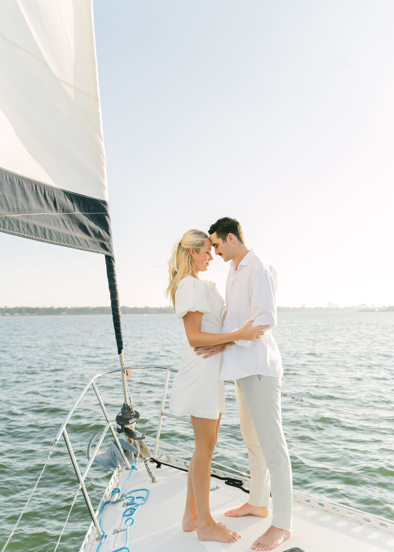 couple hugging while on a sailboat