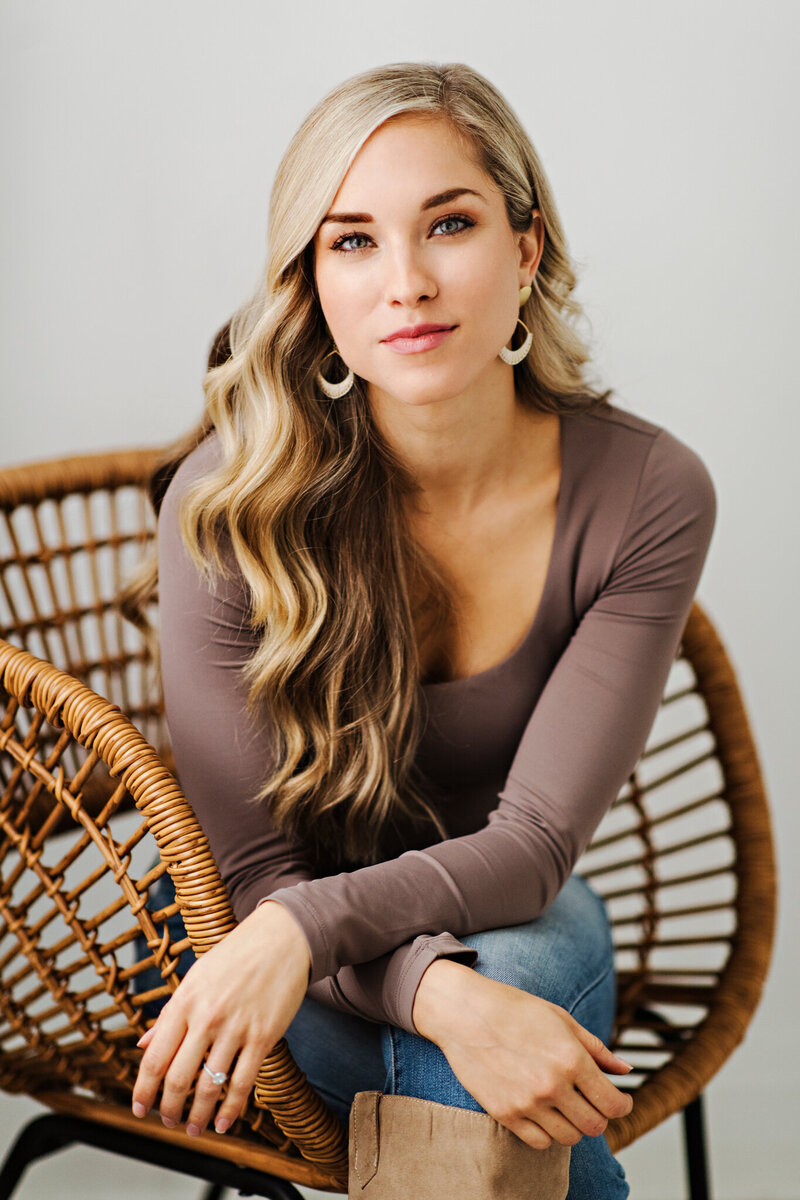 Christine Poulin Sitting in chair looking calm and happy
