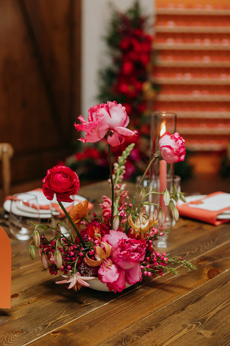 Small modern floral arrangements on long reception tables