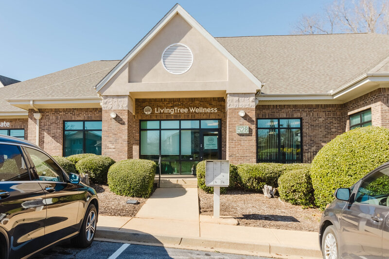 Front of LivingTree Wellness Collective building, a wellness center in Greenville, SC offering massage therapy, skincare, and acupuncture