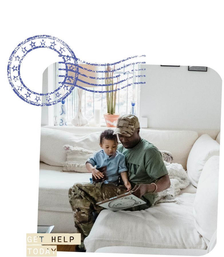 man sitting on white couch with baby on his lap