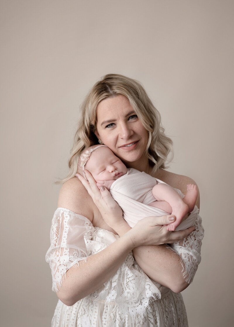 mom wearing a dress for her newborn session