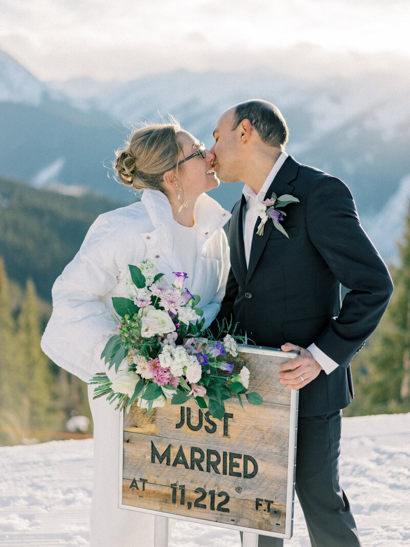 Kelsi and Everet share a sweet moment at their autumn Aspen wedding.
