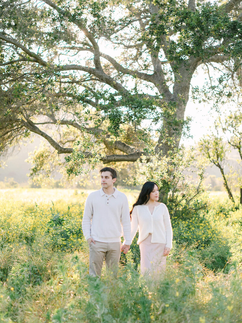 engagement photography at yellow flower field in orange county korean drama couple