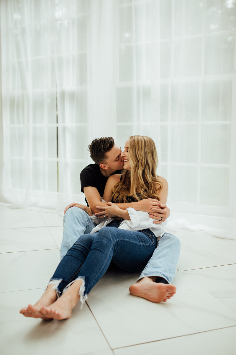 Interracial charming couple wearing casual clothes posing interacting  friendly, white studio background Stock Photo - Alamy