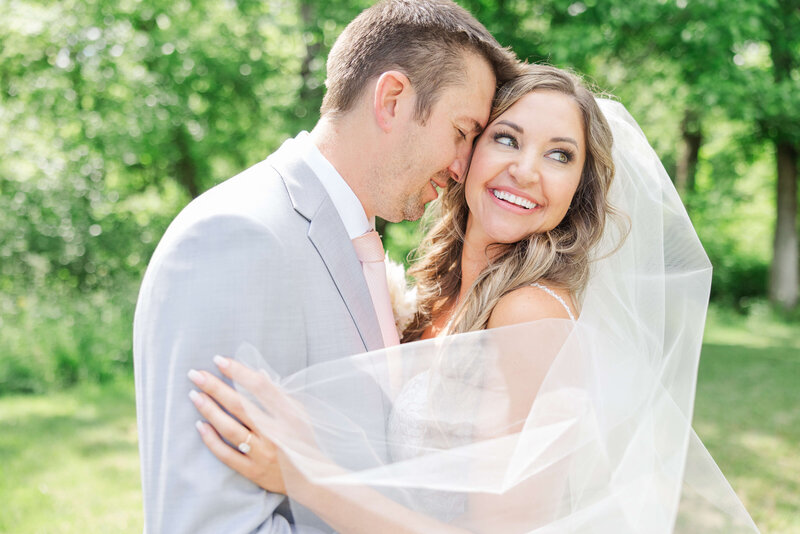 a bride and groom share their first dance at the ohio barn