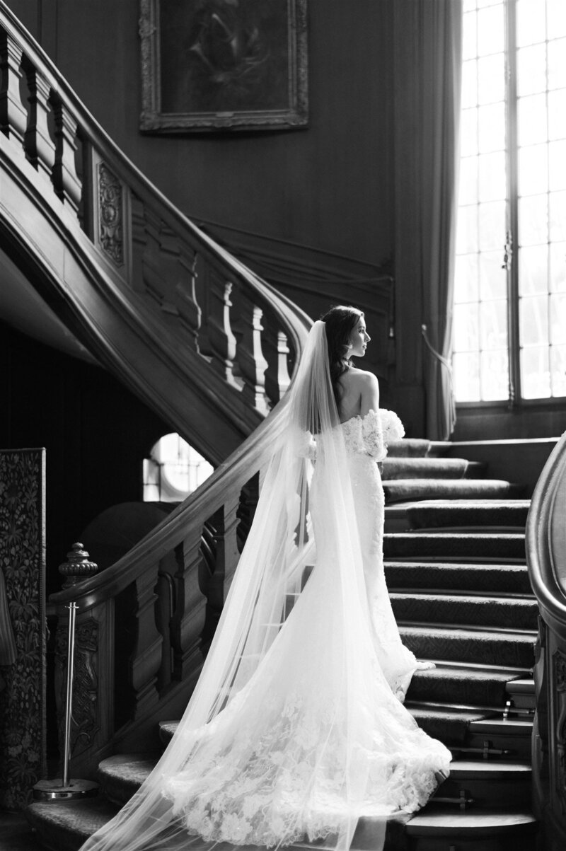 Bride is walking the stairs at St Charles hall in Switzerland