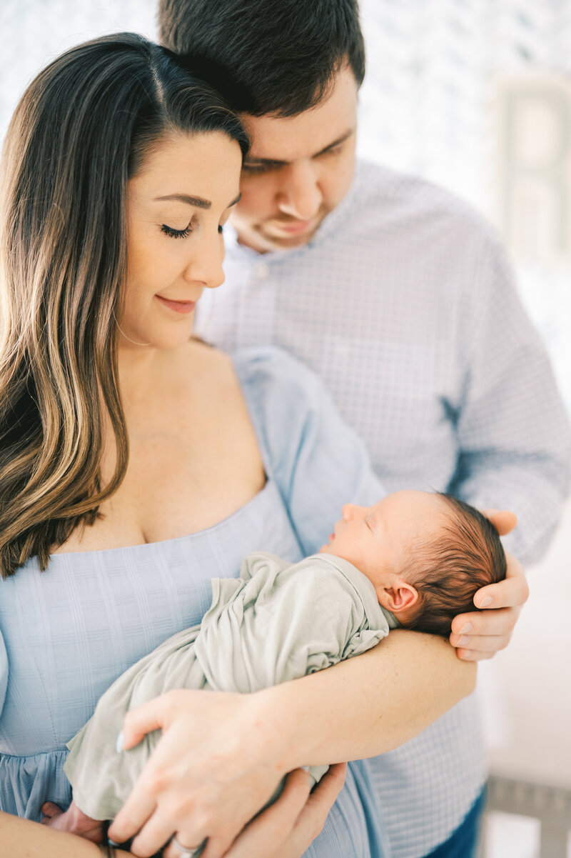 new parents holding baby Atlanta Family Photographer