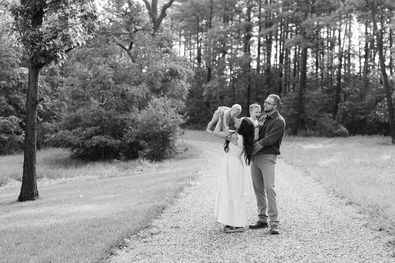 mom and dad looking down at baby