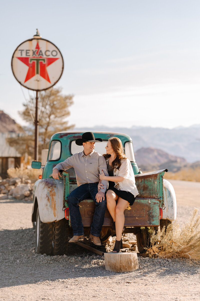 Couple sitting on truck bed