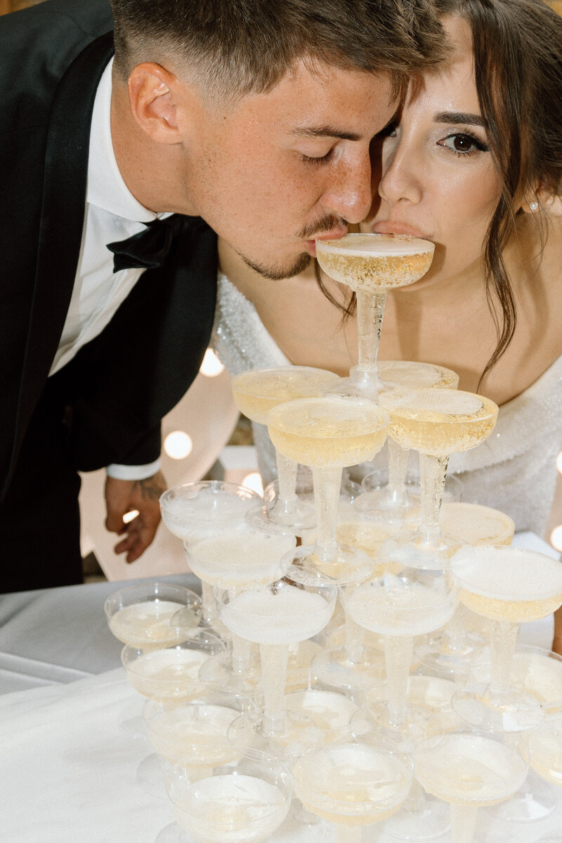 Luxury wedding in Europe – sophisticated bride in a modern wedding gown and groom in a timeless suit.