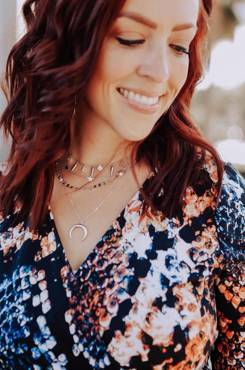 girl looking down and smiling