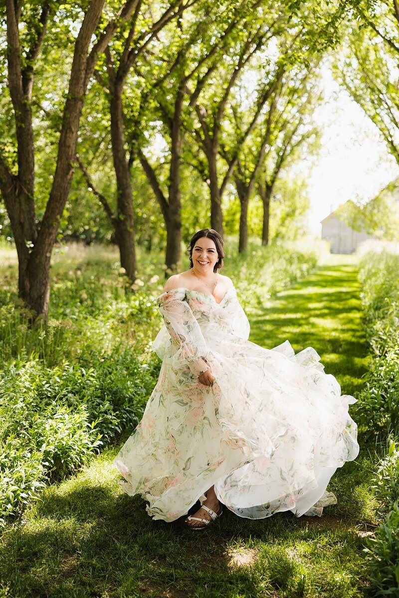 Bride twirling in a patterned wedding dress