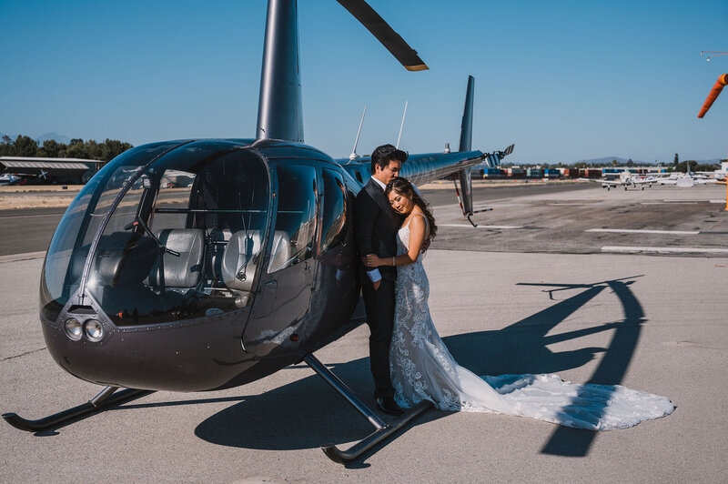 8-radiant-love-events-groom-leaning-on-helicopter-bride-leaning-on-him-outdoor-romantic-elegant-timeless