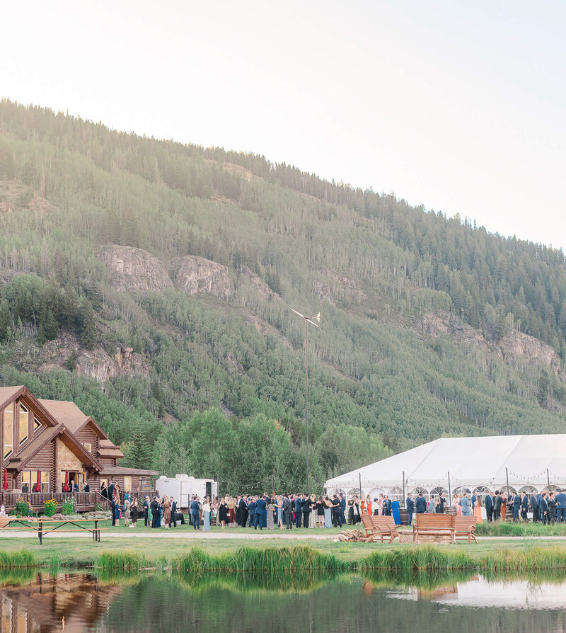 Wide view of a wedding reception at Camp Hale outside Vail, Colorado.