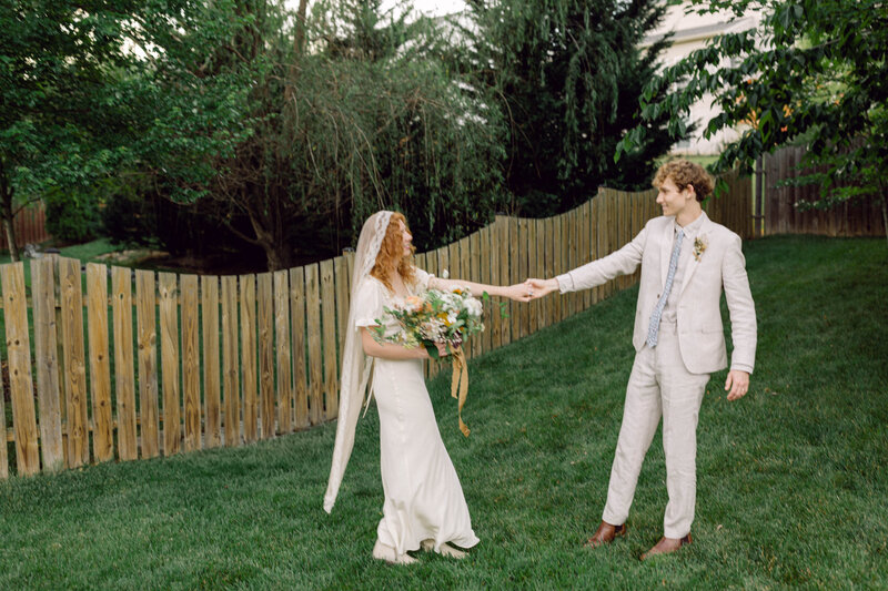 Peyton Curry and Jon share their first dance under the stars at their intimate backyard wedding in Richmond, VA, captured by a film wedding photographer.