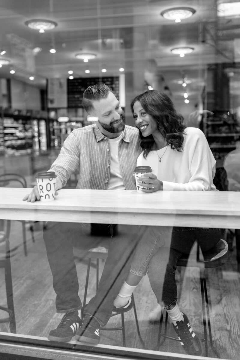 engaged couple in coffee shop engagement session