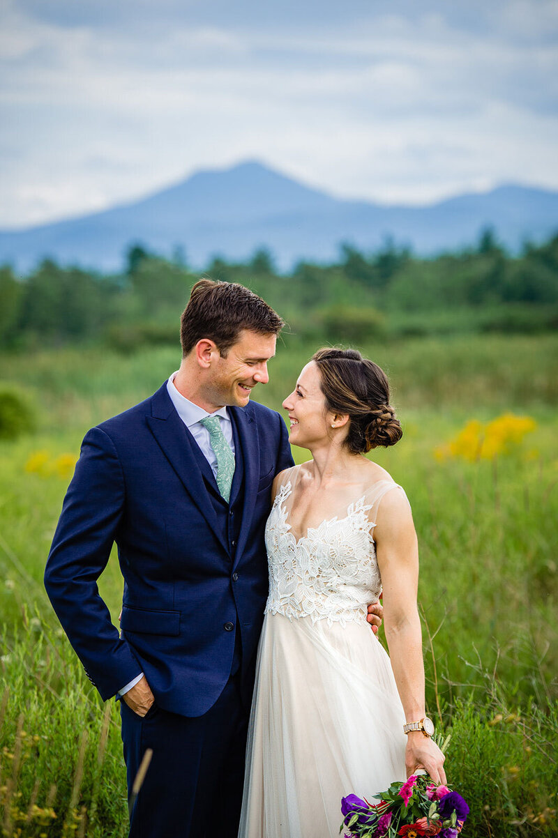 close up of couple holding hands on mount mansfield stowe vermont wedding