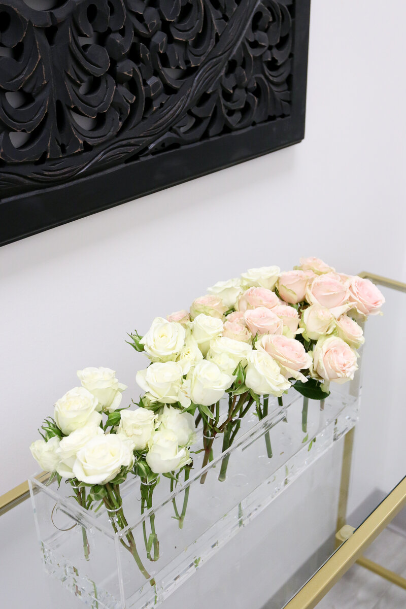 Roses in vase on entry table - Elite Med Spa of Texas