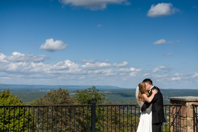 Bride and groom crying and embracing during their first look at Blue Mountain, with breathtaking views of Lehigh Valley.