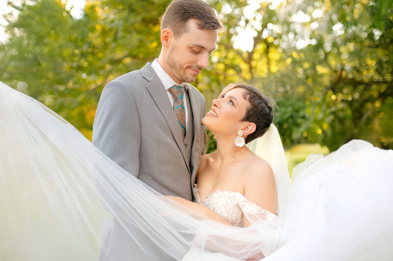A beautiful photo is captured of a bride and a groom at Oaklands Historic Mansion in Columbia Maryland by Maryland Wedding Photographer