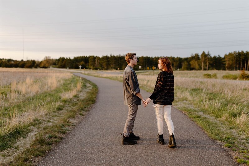 couple walking down path during engagement session