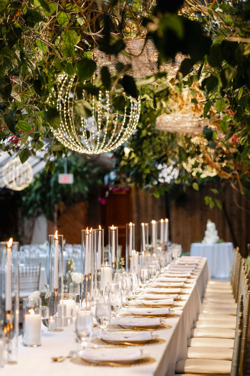 wedding tablescape with place settings and flowers at Bayfield Town Hall