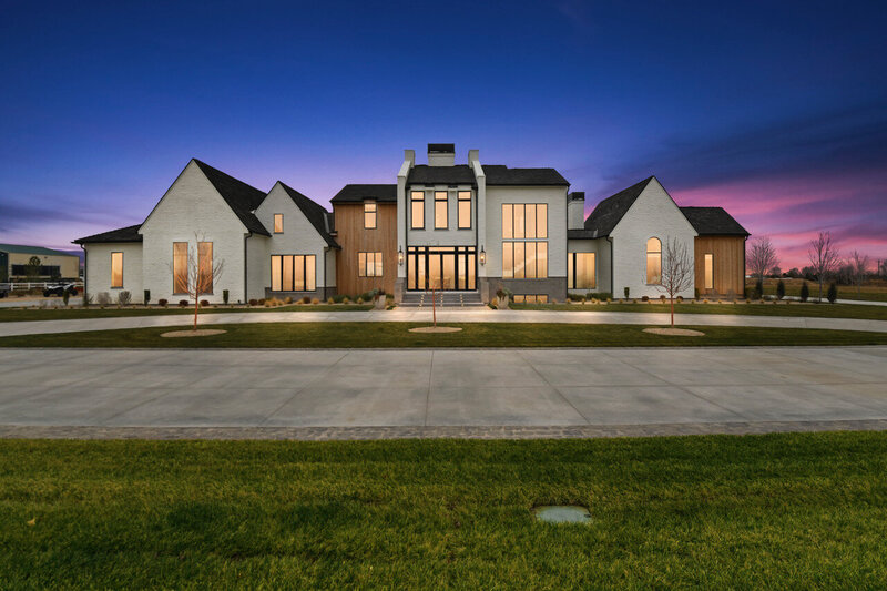Nighttime exterior shot of The Chateau Modern project by Eagle Idaho luxury custom home builder and architect Thompson Homes