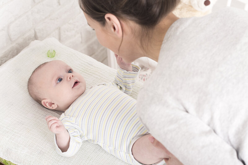 Cooing baby changing table care