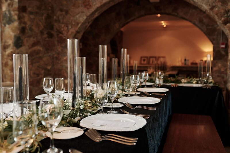 Beautiful wedding tablescape in a rustic stone setting.