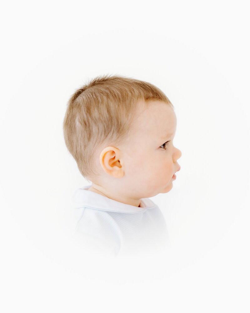 Elegant studio portrait of baby with natural expression – heirloom photographer OKC