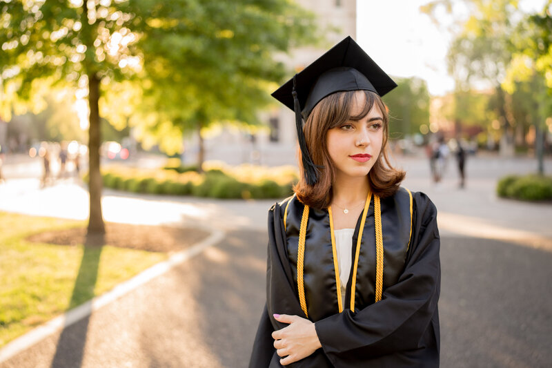 This is a female posing for her senior portraits after graduating from VCU  in Richmond, VA.