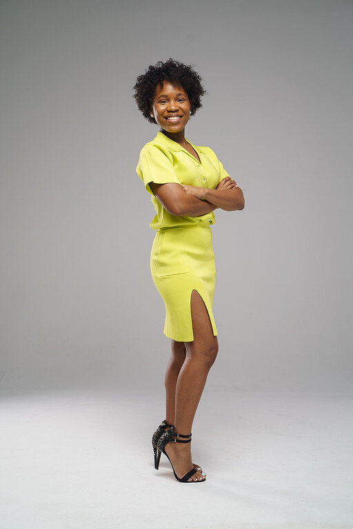 Black Business woman in a yellow dress, body shot