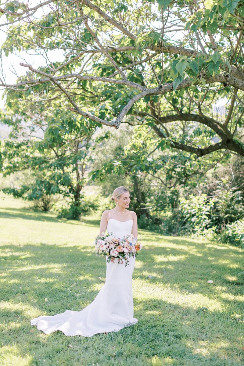 Bride standing under a tree at Pippin Hill Vineyards