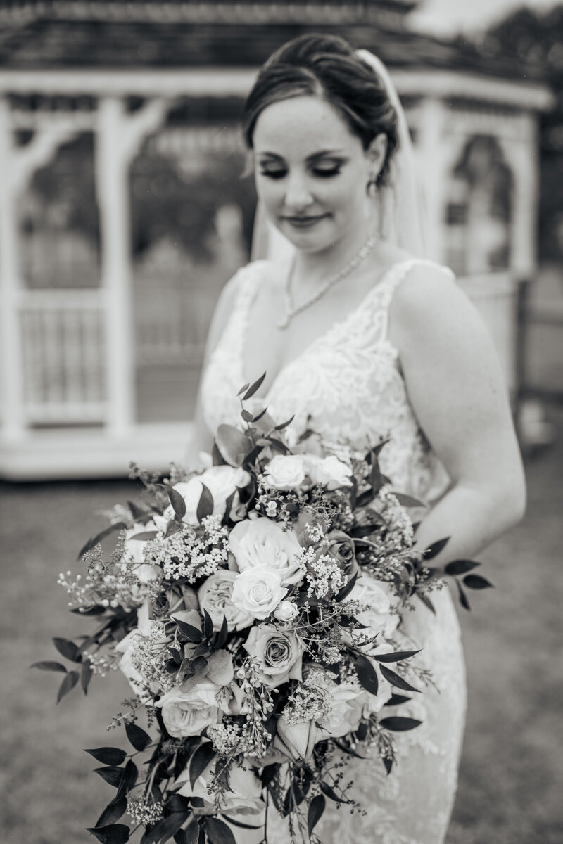 bride holding a bouquet of flowers at Wilkins Barn in Coats, NC
