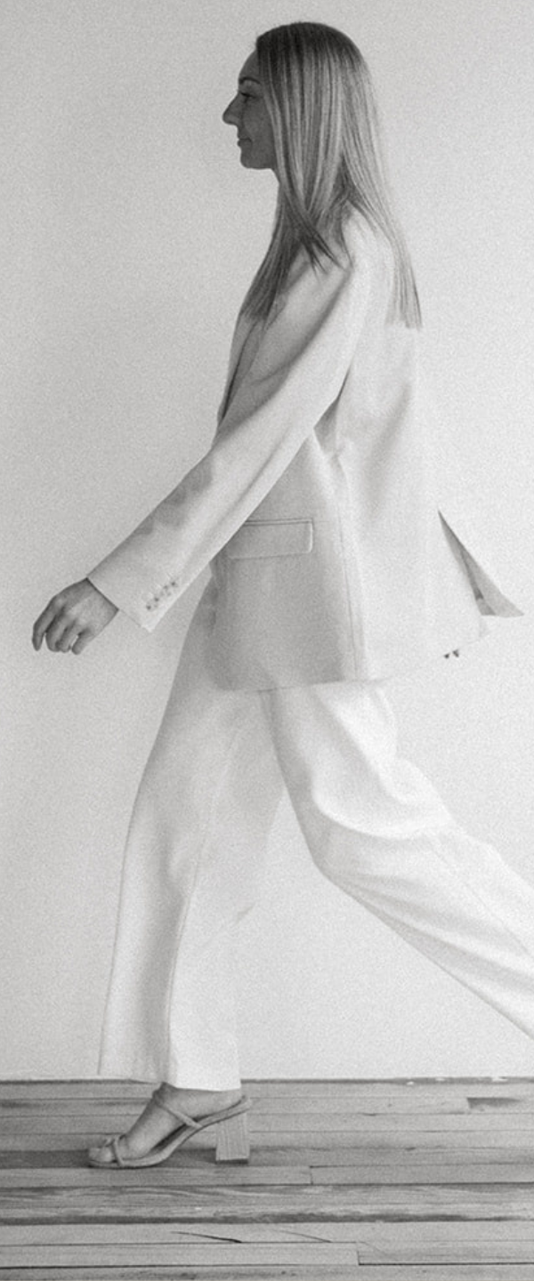 Black and White image of woman walking, social media brand photos, michigan marketing agency, social media management, arizona social media management