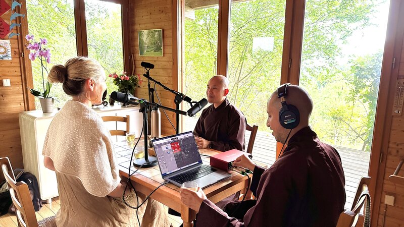 Dr. Diana Hill, ACT Psychologist Leadership Coach, podcasting inside of Thich Nhat Hahn's hut