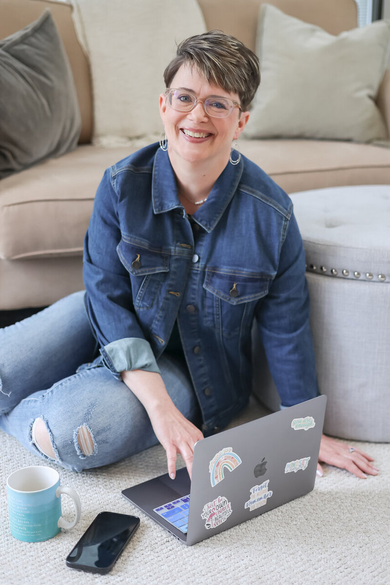 Smiling entrepreneur using CRM software to streamline business workflows