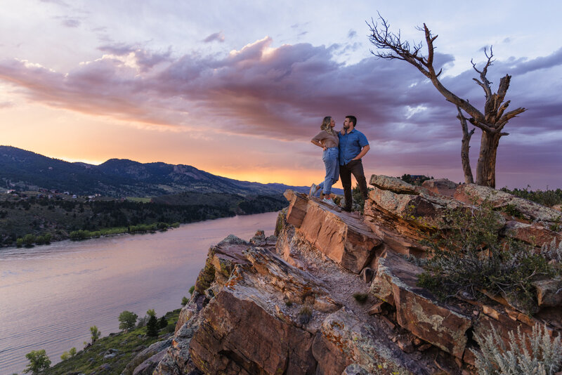couple sitting on horsetooth reservoir